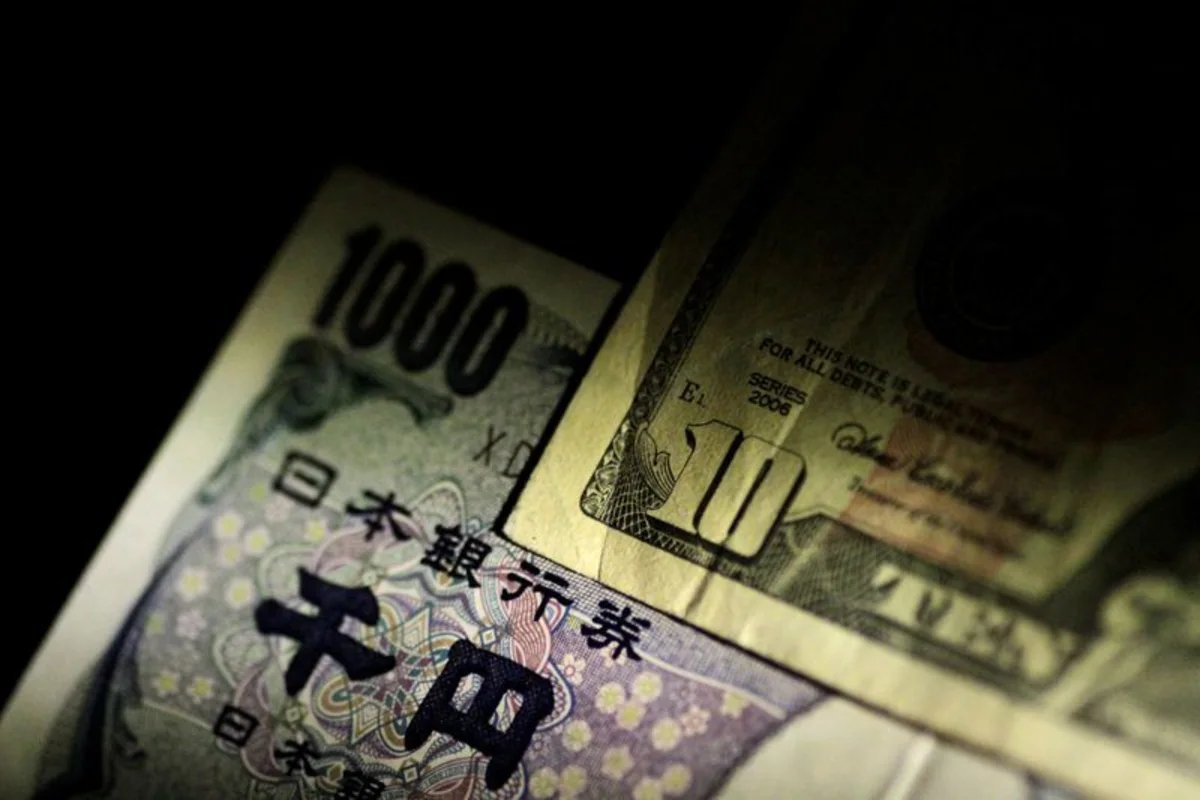 Dollar slides after soft jobs report, yen surges