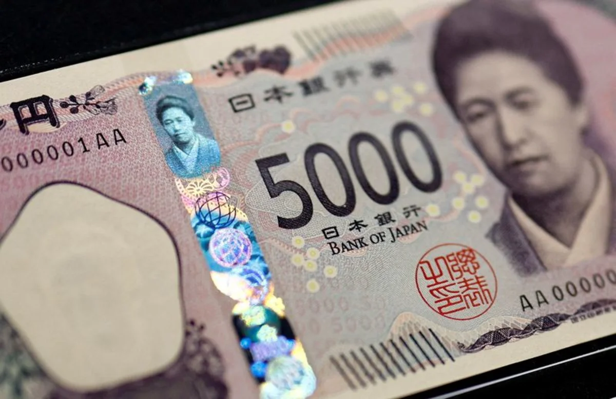 Dollar pushes higher, yen sinks to 40-year low