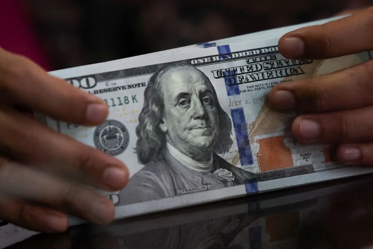 Dollar feeble as rate hike bets dwindle, Iran conflict in focus